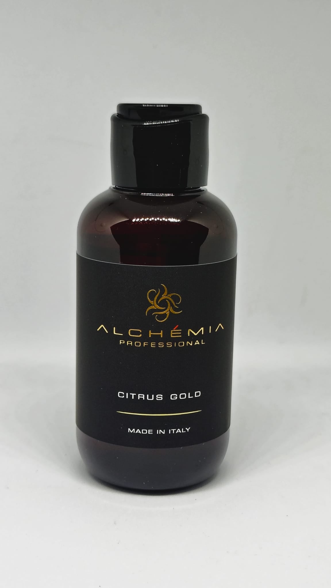 Shampoo Oil Total body-Citrus Gold bottle with a sleek design, made in Italy, perfect for hair and body care.